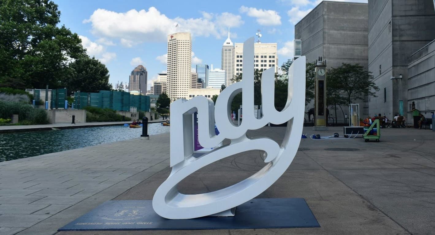 Indianapolis 'NDY' sign sculpture with the downtown skyline in the background