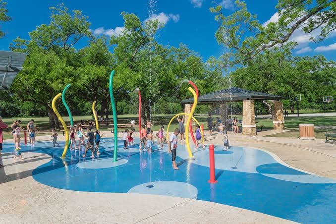 Kids playing at a Washington DC splash pad on a hot summer day